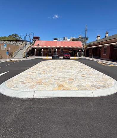 Archaeological sandstone layed by early settlers uncovered during construction was incorporated into the Dalys Way roundabout as a heritage feature.